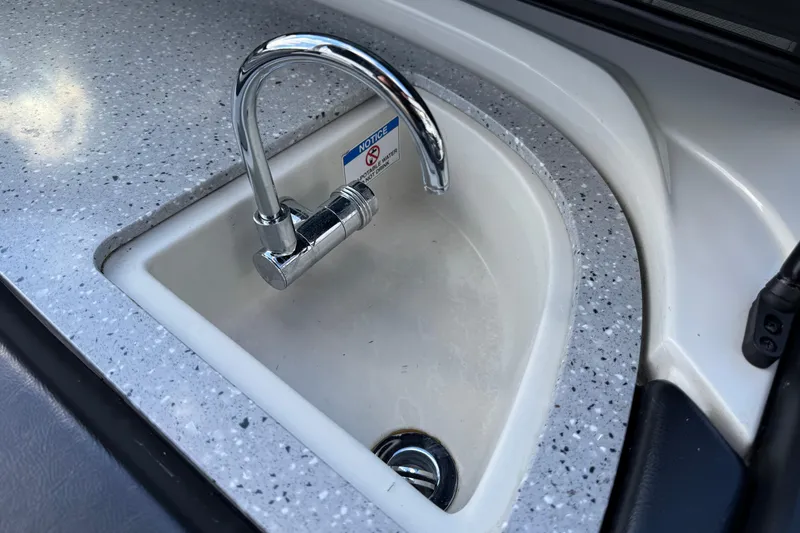 Slide: The Image of Stainless steel faucet and sink on 2022 South Bay 25 Sport RS9-DC boat. - 31