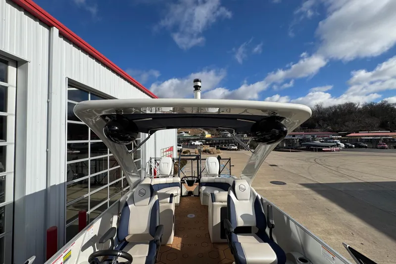 Slide: The Image of 2022 South Bay 25 Sport RS9-DC boat at marina, clear sky background. - 38