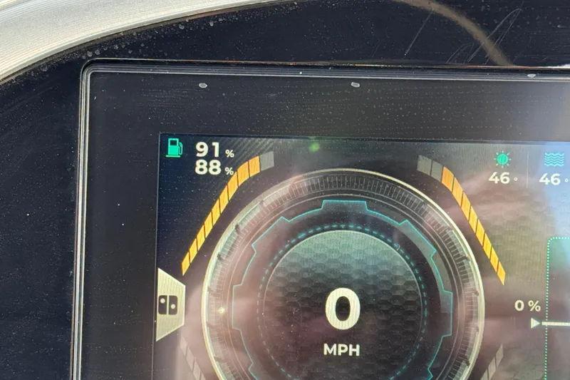Slide: The Image of Dashboard display of 2022 South Bay 25 Sport RS9-DC showing 0 MPH and fuel levels. - 41