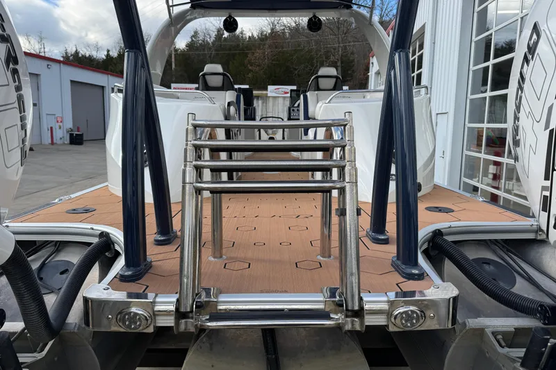 Slide: The Image of 2022 South Bay 25 Sport RS9-DC boat with rear deck and ladder. - 7