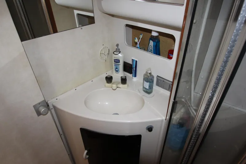 Slide: The Image of Bathroom sink area in a 1990 Silverton 34 Convertible yacht. - 28