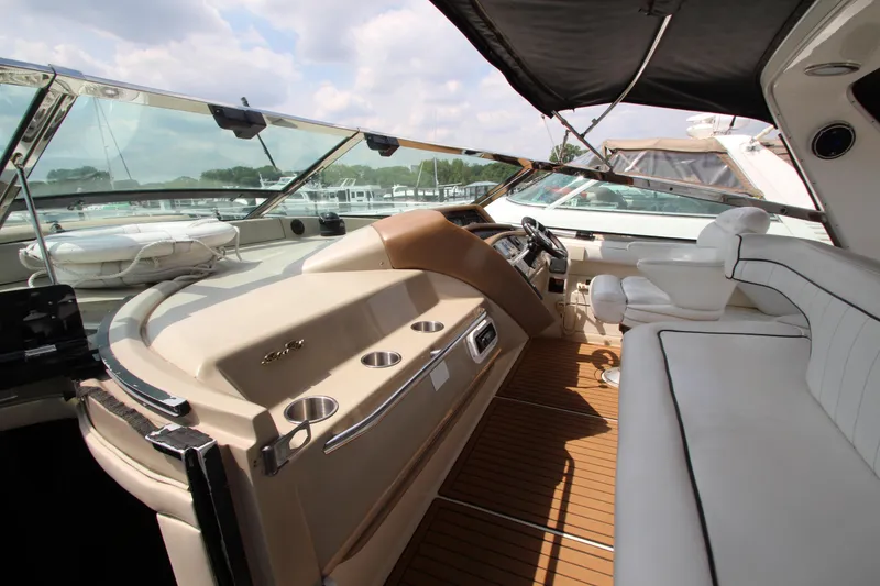 Slide: The Image of 1998 Sea Ray 500 Sundancer yacht cockpit with luxurious seating and modern controls. - 27