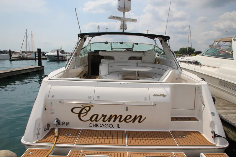 Slide: The Image of 1998 Sea Ray 500 Sundancer yacht docked at a marina, named Carmen from Chicago, IL. - 3