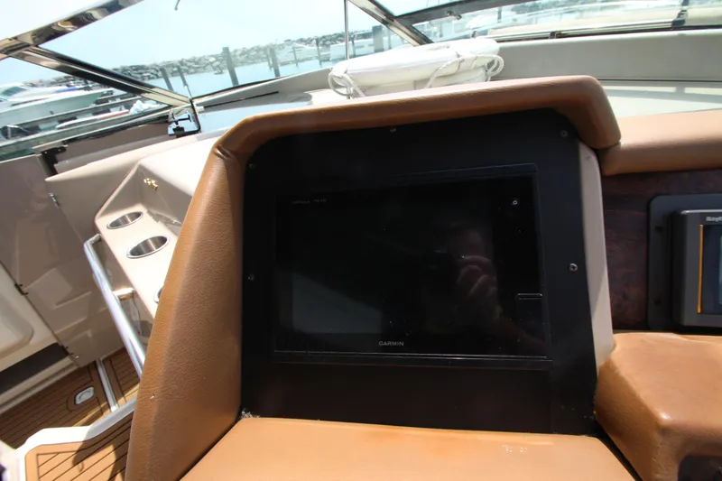 Slide: The Image of Control panel of a 1998 Sea Ray 500 Sundancer yacht. - 31