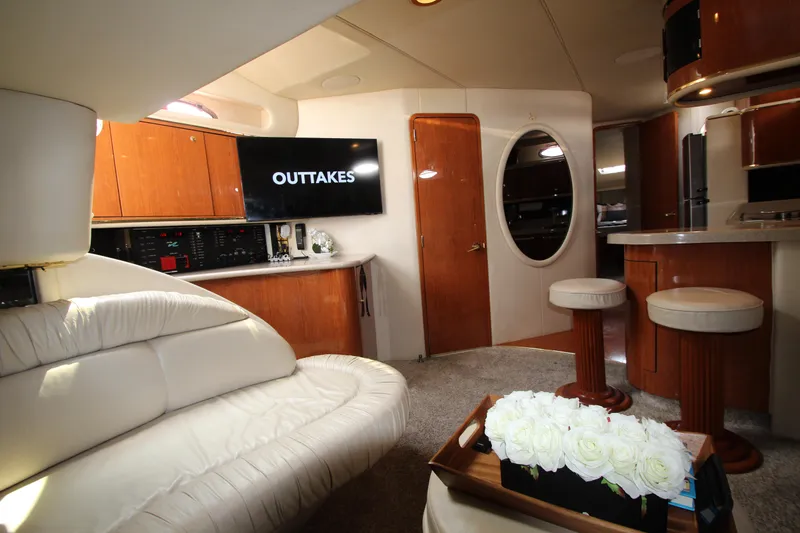 Slide: The Image of Luxurious interior of 1998 Sea Ray 500 Sundancer yacht with leather seating and modern amenities. - 35