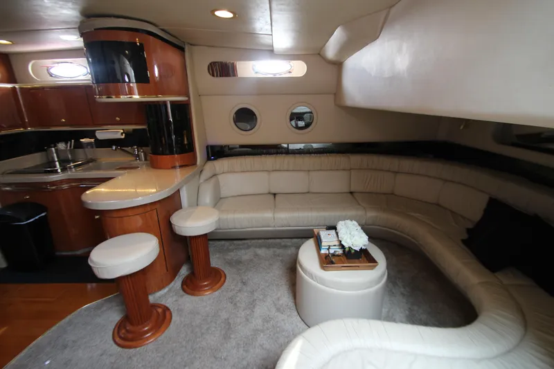 Slide: The Image of Luxurious interior of 1998 Sea Ray 500 Sundancer yacht with leather seating and modern kitchen. - 36
