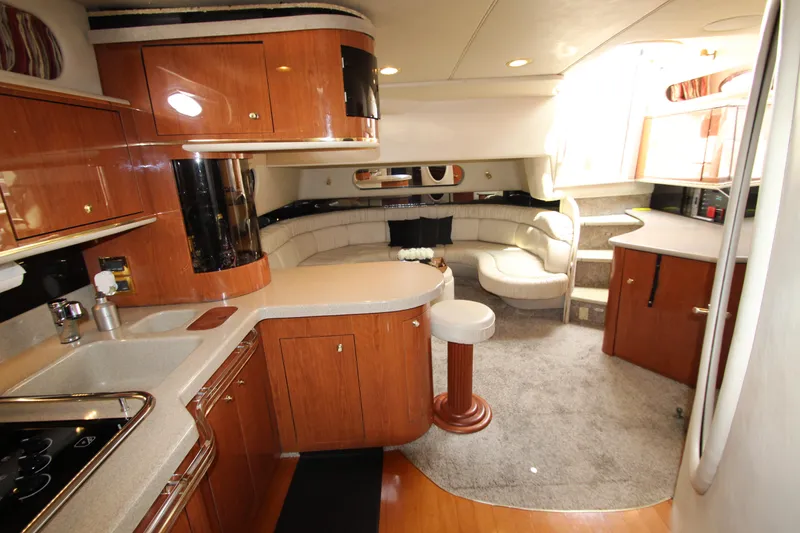 Slide: The Image of 1998 Sea Ray 500 Sundancer yacht interior with kitchen and seating area - 38