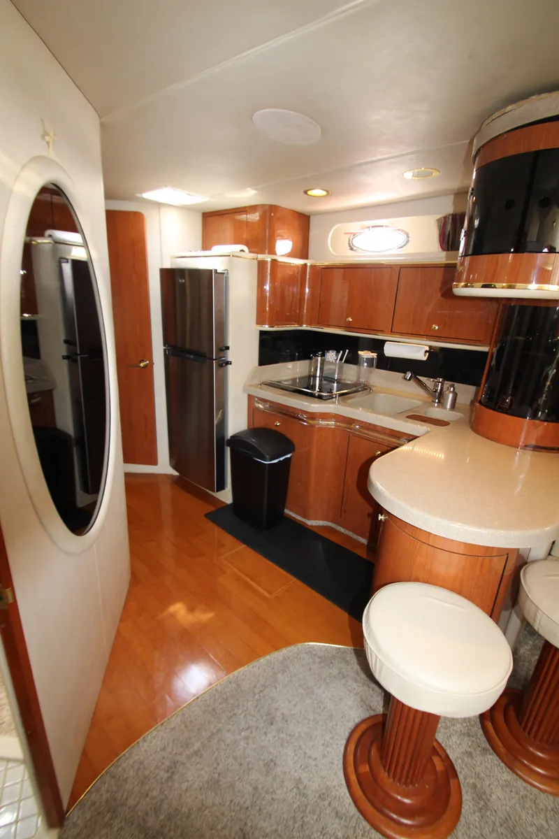 Slide: The Image of 1998 Sea Ray 500 Sundancer yacht kitchen with modern amenities. - 43