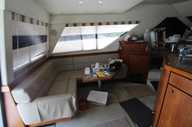 Slide: The Image of Interior of 1996 Bayliner 3988 Command Bridge Motoryacht with seating and table. - 18