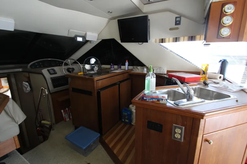 Slide: The Image of Interior of 1996 Bayliner 3988 Command Bridge Motoryacht with kitchen and helm area. - 20