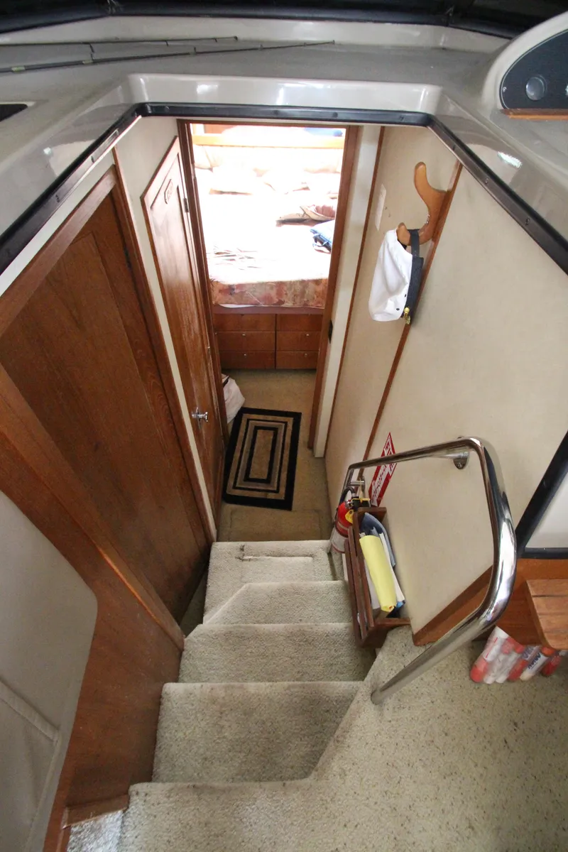 Slide: The Image of Interior view of 1996 Bayliner 3988 Command Bridge Motoryacht, showing stairs and cabin entrance. - 22