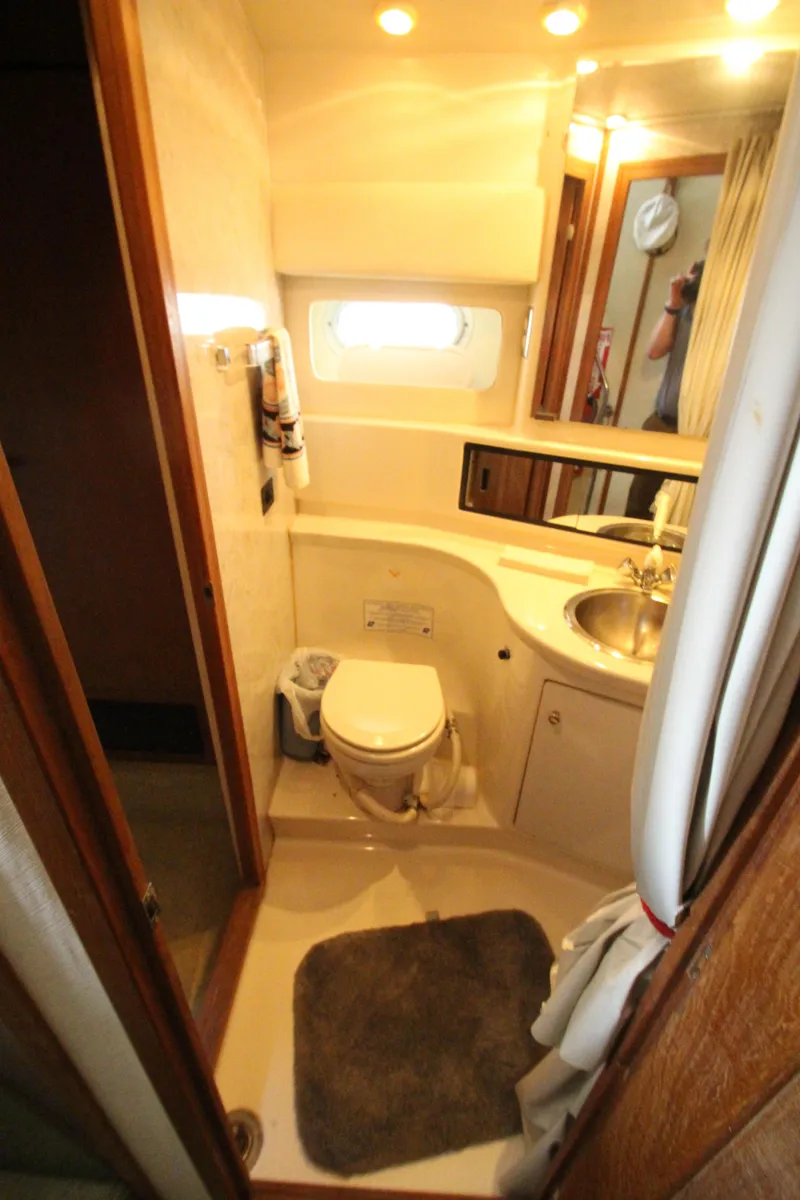 Slide: The Image of Bathroom interior of 1996 Bayliner 3988 Command Bridge Motoryacht with sink and toilet. - 30