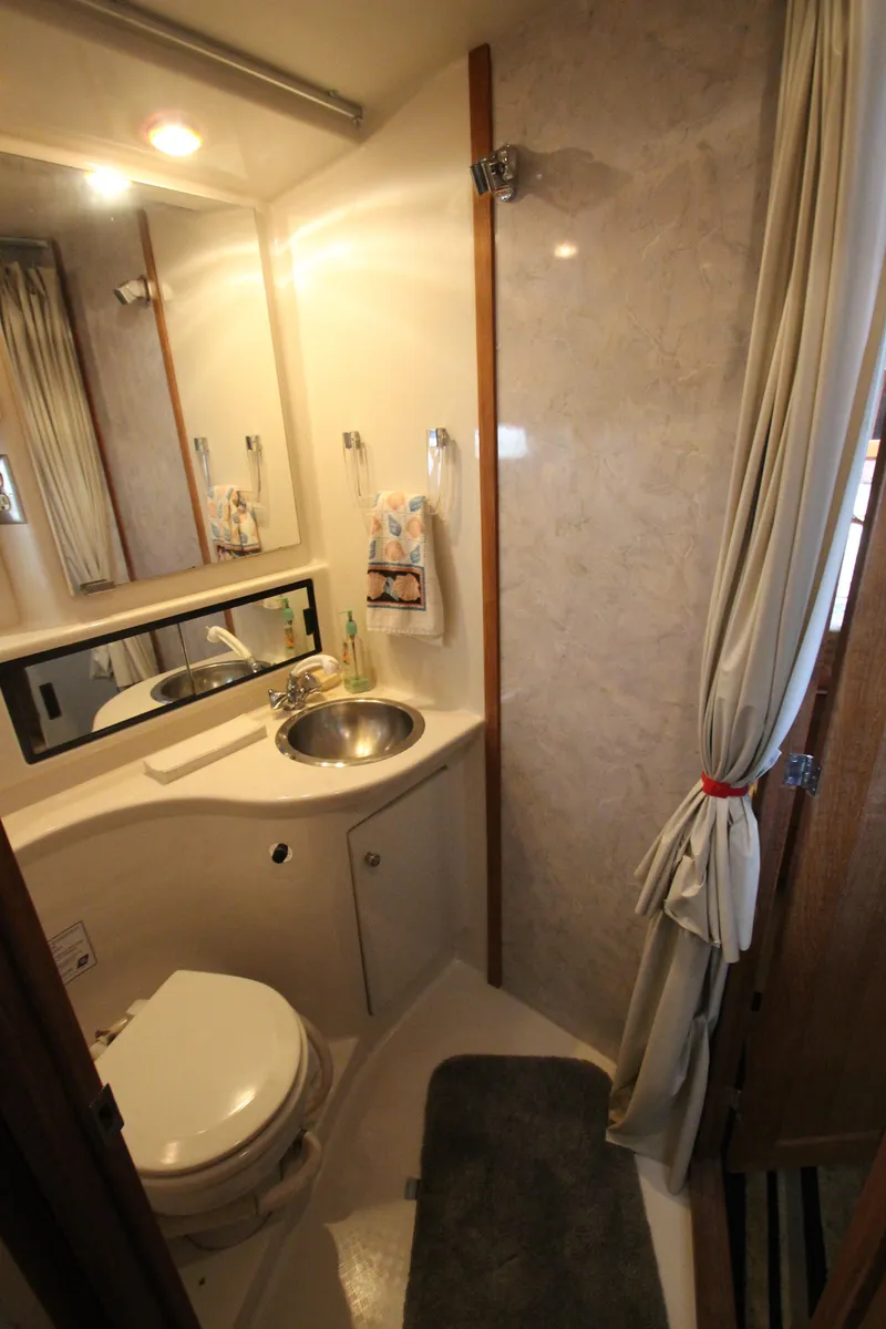 Slide: The Image of Bathroom interior of 1996 Bayliner 3988 Command Bridge Motoryacht with sink and toilet. - 31