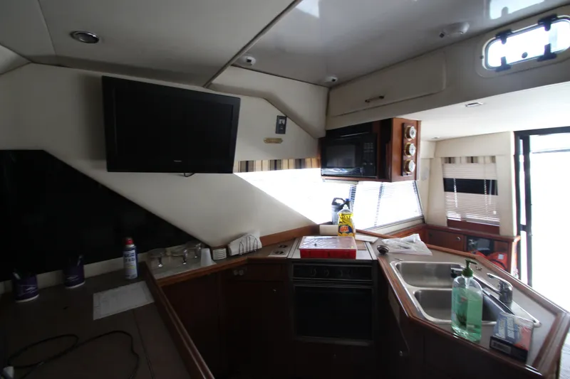 Slide: The Image of Interior of 1996 Bayliner 3988 Command Bridge Motoryacht kitchen with appliances and sink. - 34