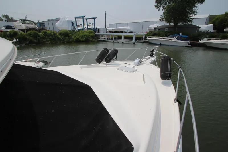 Slide: The Image of 1996 Bayliner 3988 Command Bridge Motoryacht docked in a marina. - 8