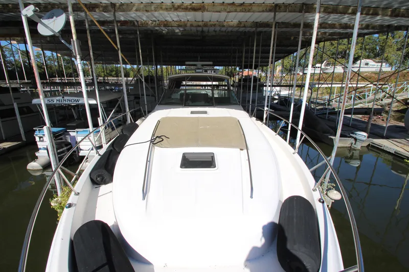 Slide: The Image of 2001 Sea Ray 460 Sundancer yacht docked in covered marina. - 16