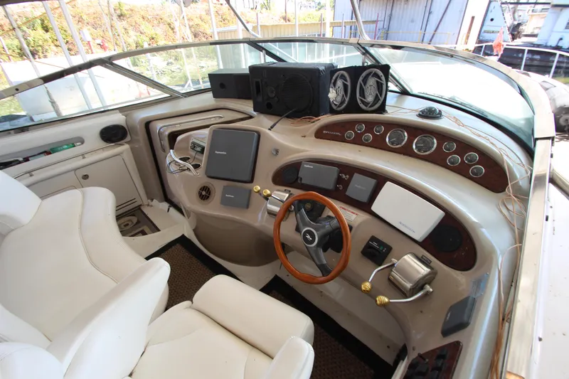 Slide: The Image of Interior helm of 2001 Sea Ray 460 Sundancer yacht with steering wheel and control panels. - 20