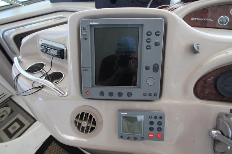 Slide: The Image of 2001 Sea Ray 460 Sundancer dashboard with navigation equipment and controls. - 27