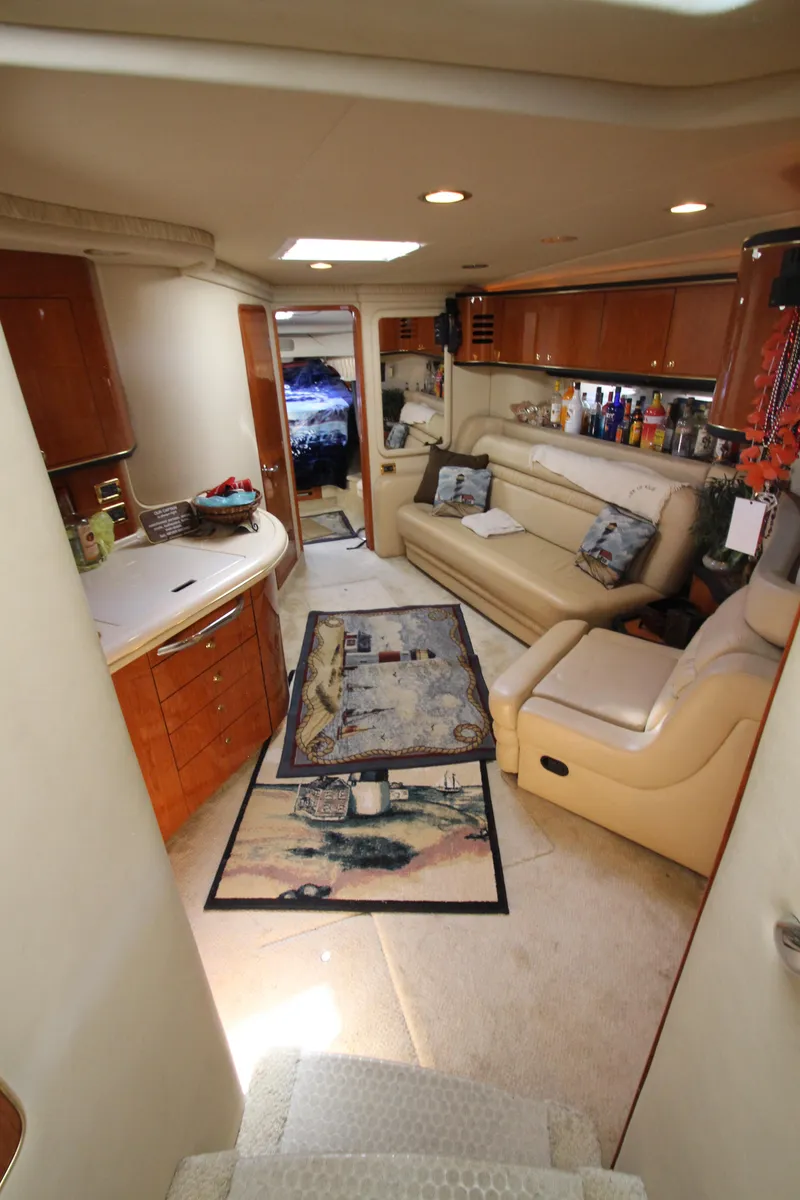 Slide: The Image of Luxurious interior of 2001 Sea Ray 460 Sundancer yacht with elegant seating and decor. - 29