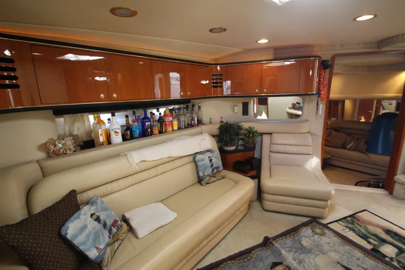 Slide: The Image of Luxurious interior of 2001 Sea Ray 460 Sundancer yacht with plush seating and bar area. - 33