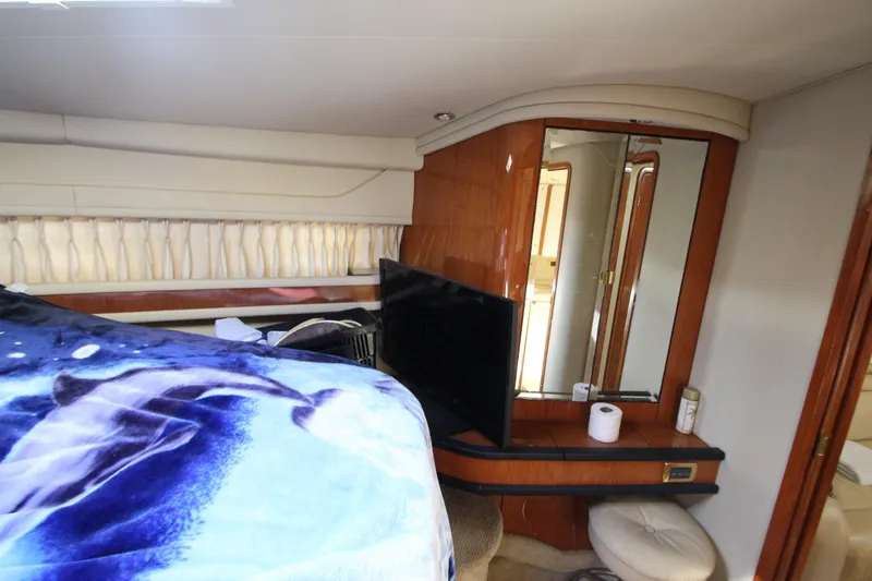 Slide: The Image of Interior of 2001 Sea Ray 460 Sundancer yacht with bed, TV, and mirror. - 44