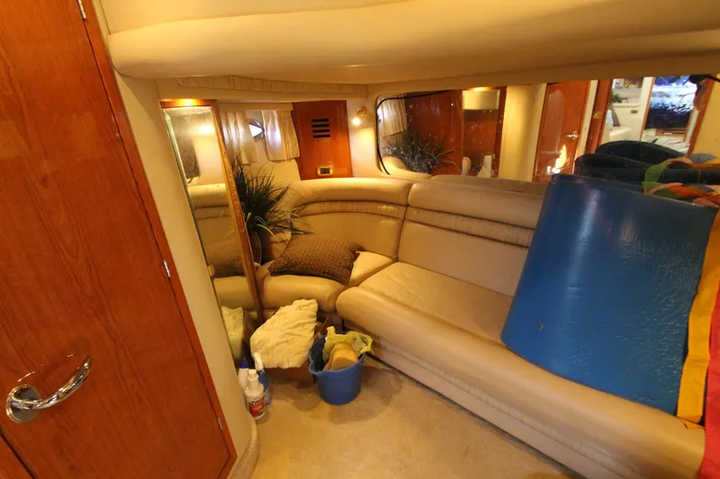 Slide: The Image of Interior of 2001 Sea Ray 460 Sundancer yacht with beige seating and decor. - 48