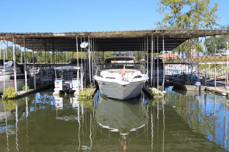 Slide: The Image of 2001 Sea Ray 460 Sundancer docked in a covered marina. - 7