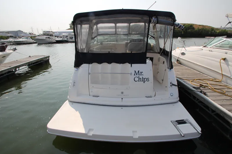 Slide: The Image of 2005 Rinker 312 Fiesta Vee boat docked at marina, rear view. - 2