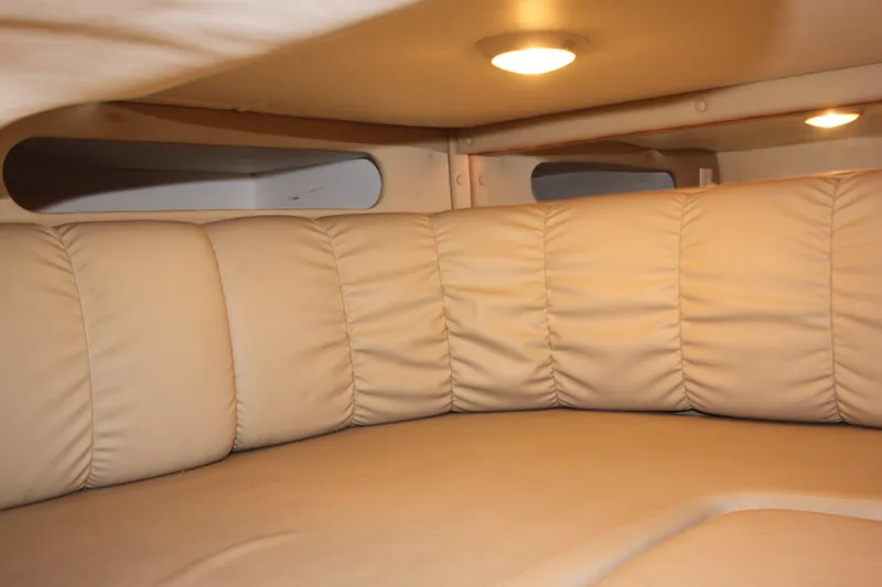 Slide: The Image of 2005 Rinker 312 Fiesta Vee cabin interior with beige leather seating. - 29
