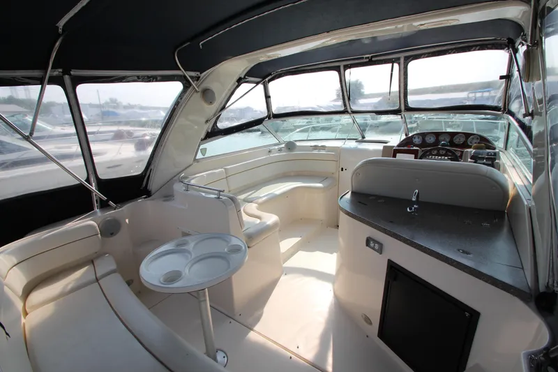Slide: The Image of Interior of 2005 Rinker 312 Fiesta Vee boat with seating and helm station. - 7