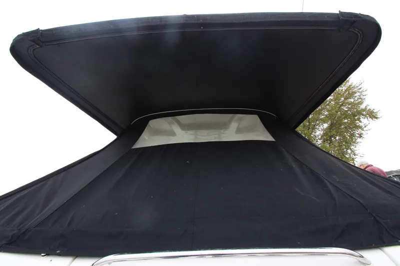 Slide: The Image of 2007 Sea Ray 44 Sundancer with black canvas cover, rear view. - 15