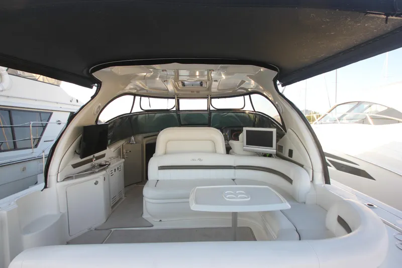Slide: The Image of 2007 Sea Ray 44 Sundancer yacht interior with seating, table, and entertainment system. - 16
