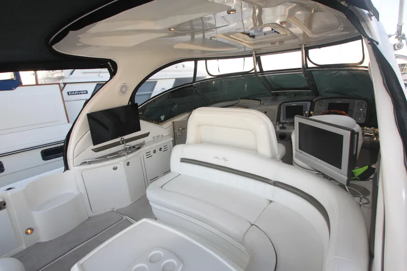 Slide: The Image of 2007 Sea Ray 44 Sundancer yacht interior with white seating and modern electronics. - 19