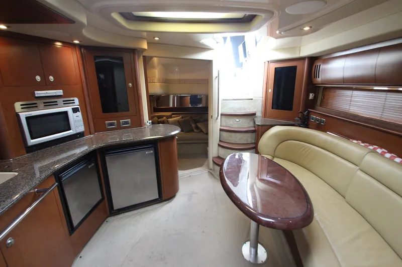 Slide: The Image of Interior of 2007 Sea Ray 44 Sundancer yacht with kitchen and seating area. - 34