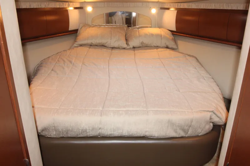 Slide: The Image of Luxurious bedroom interior of 2007 Sea Ray 44 Sundancer yacht with cozy bedding. - 38
