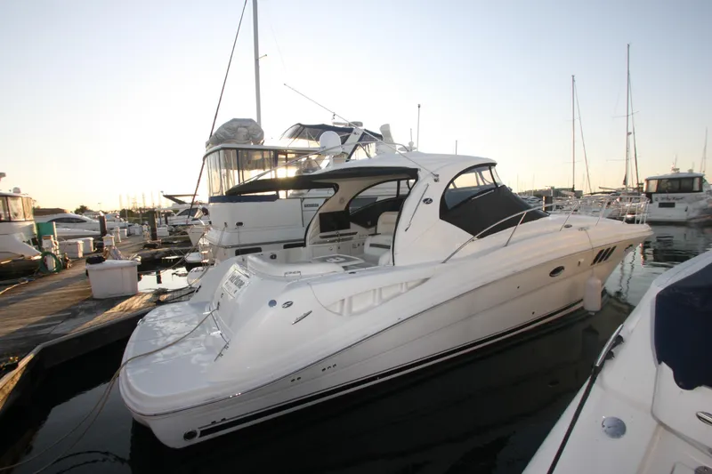 Slide: The Image of 2007 Sea Ray 44 Sundancer yacht docked at marina during sunset. - 7