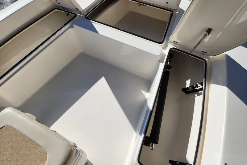 Slide: The Image of Open storage compartments on a 2014 Pathfinder 2200 TRS boat. - 17