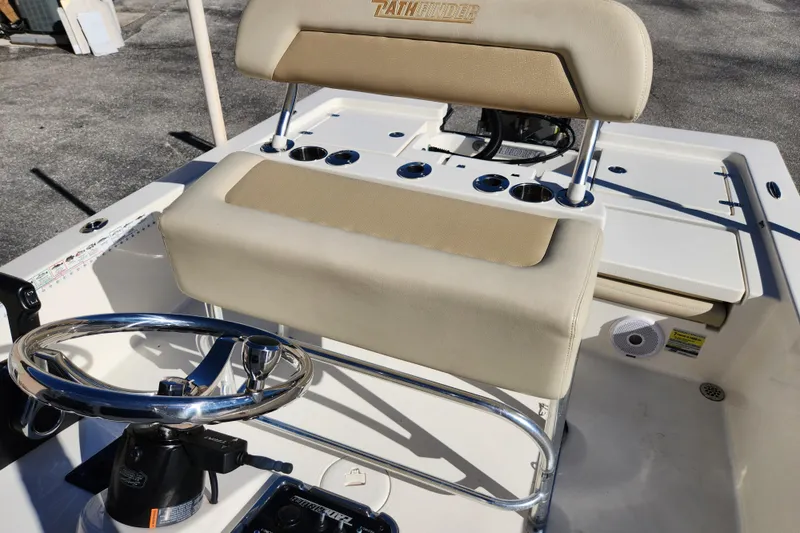 Slide: The Image of 2014 Pathfinder 2200 TRS boat interior with steering wheel and seating. - 23