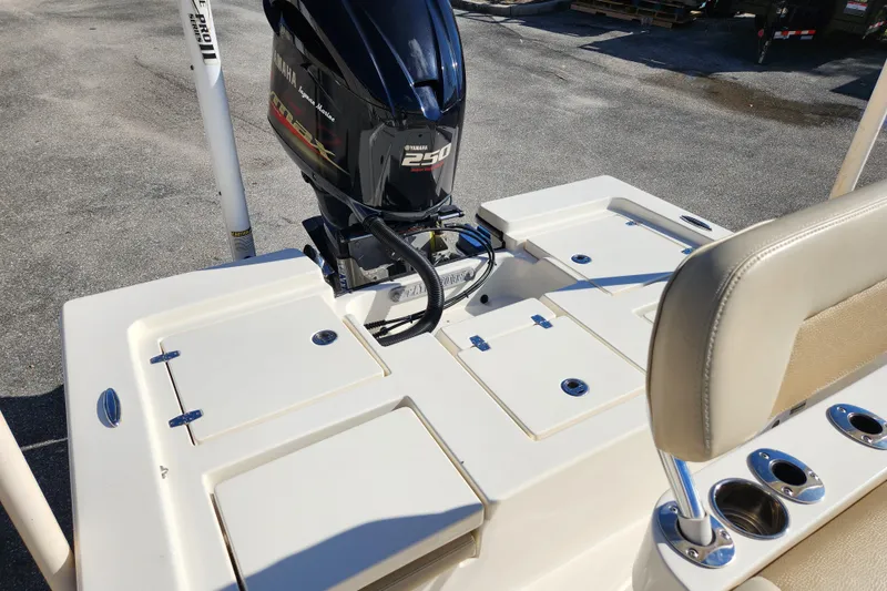 Slide: The Image of 2014 Pathfinder 2200 TRS boat with Yamaha 250 engine, featuring beige seating and storage compartments. - 25
