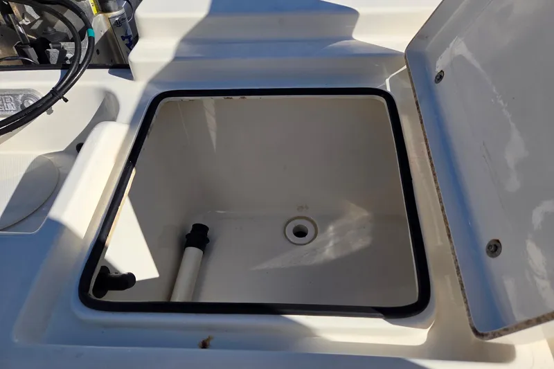 Slide: The Image of Open storage compartment on a 2014 Pathfinder 2200 TRS boat. - 28