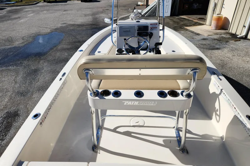 Slide: The Image of 2014 Pathfinder 2200 TRS boat interior with steering console and seating. - 8