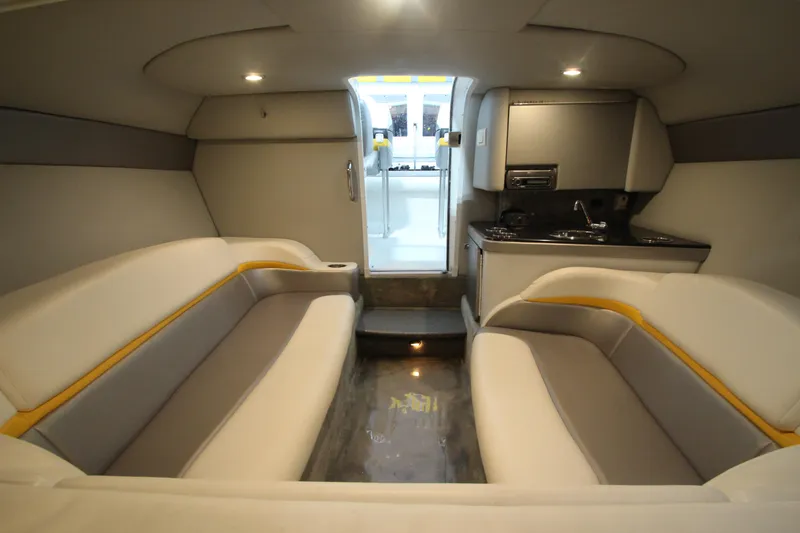 Slide: The Image of Interior of 2008 Formula 292 FASTech boat with seating and kitchenette. - 25