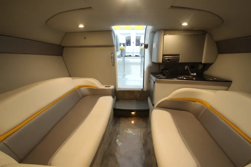Slide: The Image of Interior of a 2008 Formula 292 FASTech boat with seating and kitchenette. - 26
