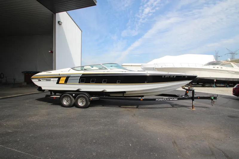 Slide: The Image of 2008 Formula 292 FASTech boat on trailer, parked outside a storage facility. - 3