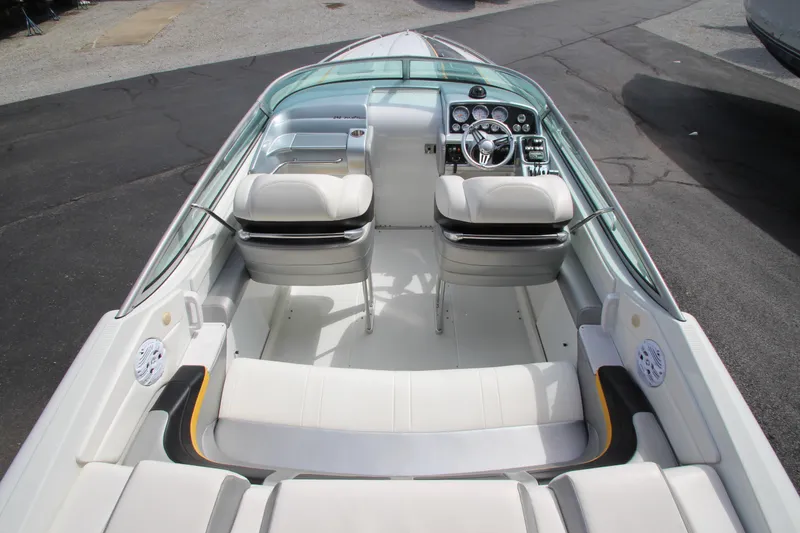 Slide: The Image of 2008 Formula 292 FASTech boat interior with white seating and modern dashboard. - 9
