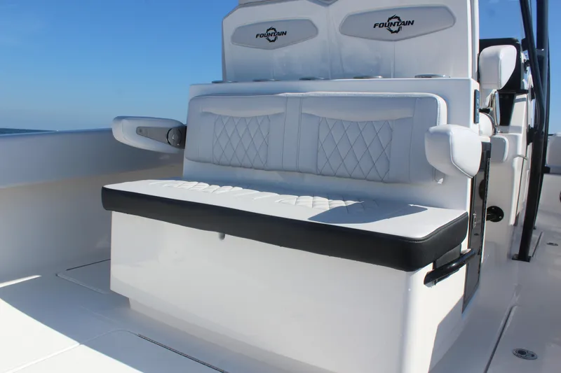 Slide: The Image of 2025 Fountain 34 Center Console boat with luxurious white seating and sleek design. - 10