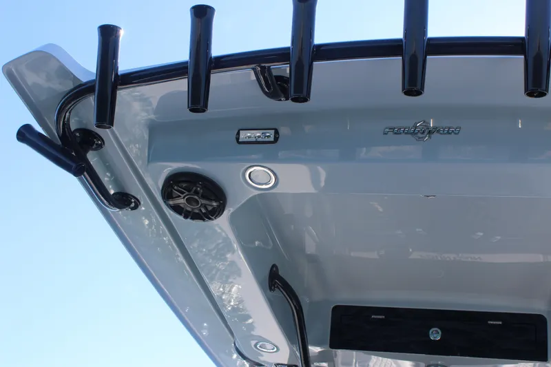 Slide: The Image of 2025 Fountain 34 Center Console boat roof with rod holders and speaker. - 13