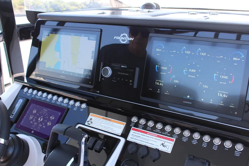 Slide: The Image of 2025 Fountain 34 Center Console dashboard with advanced Garmin navigation displays. - 18