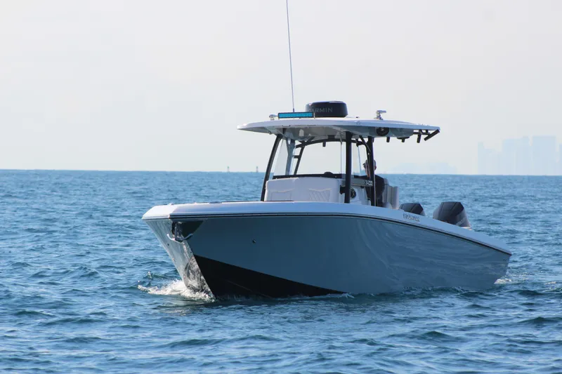 Slide: The Image of 2025 Fountain 34 Center Console boat cruising on open water. - 3