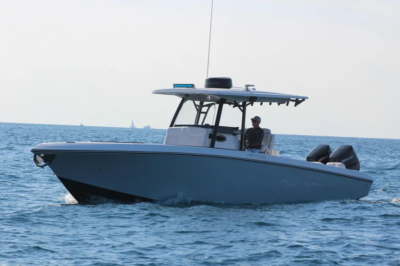 Slide: The Image of 2025 Fountain 34 Center Console boat cruising on open water. - 4
